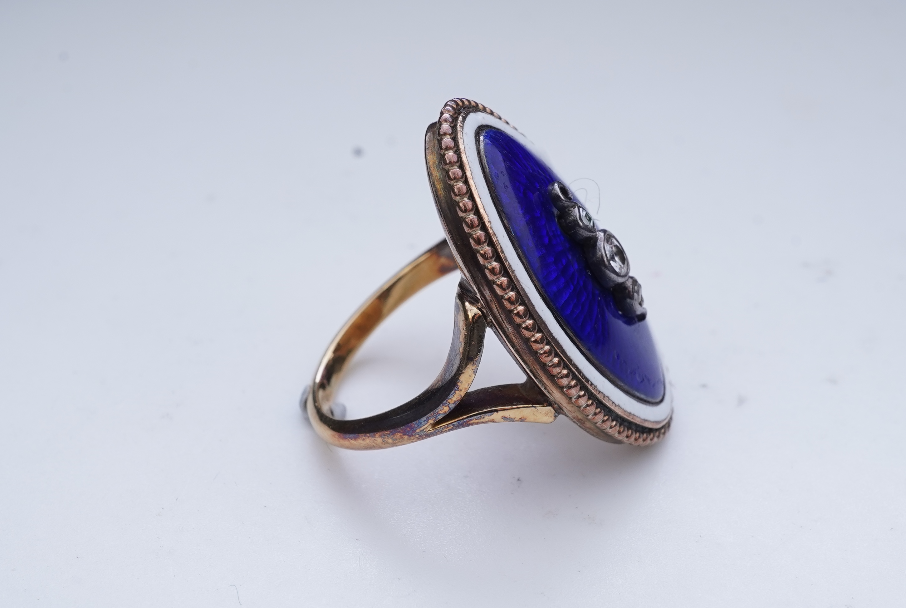 An enamel and diamond mourning ring, late 19th century